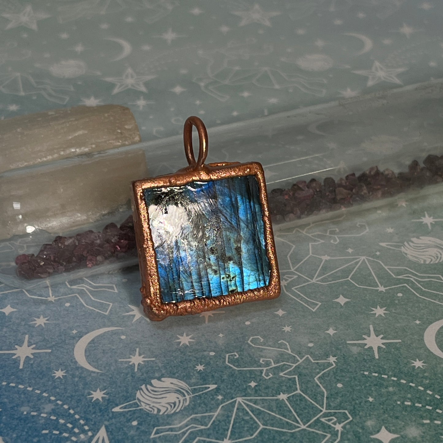 the back of a blue flashy labradorite pendant necklace 