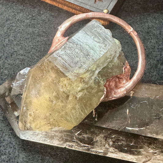 Crystal pendant with Brazilian Lodalite quartz with inclusions.