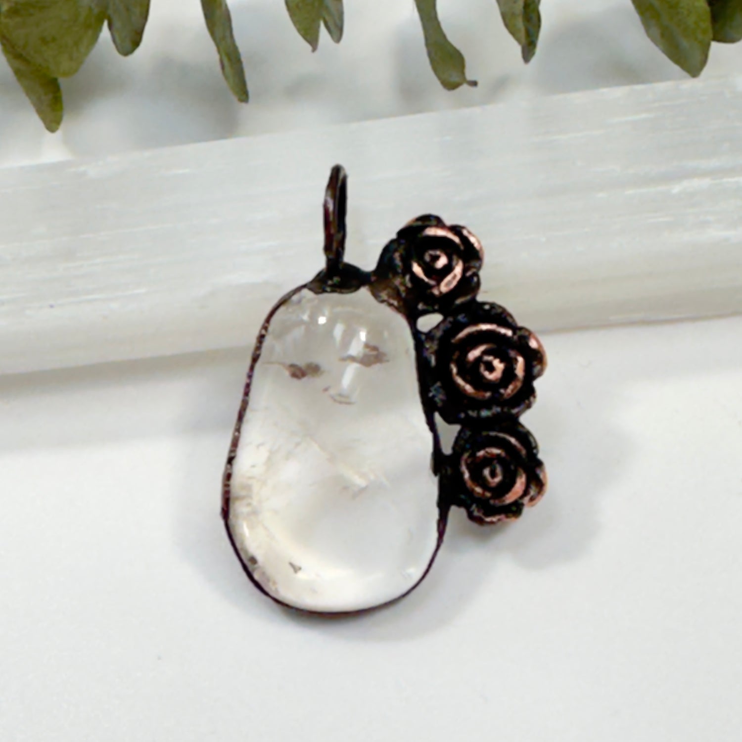 Clear quartz crystal necklace with antique roses