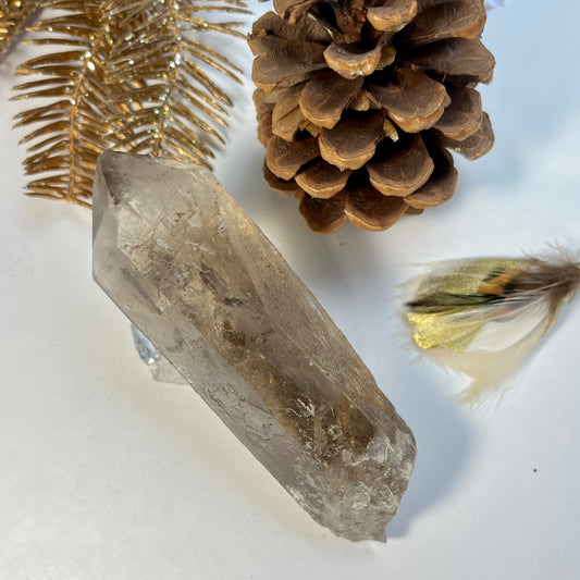 translucent smoky quartz long crystal point.