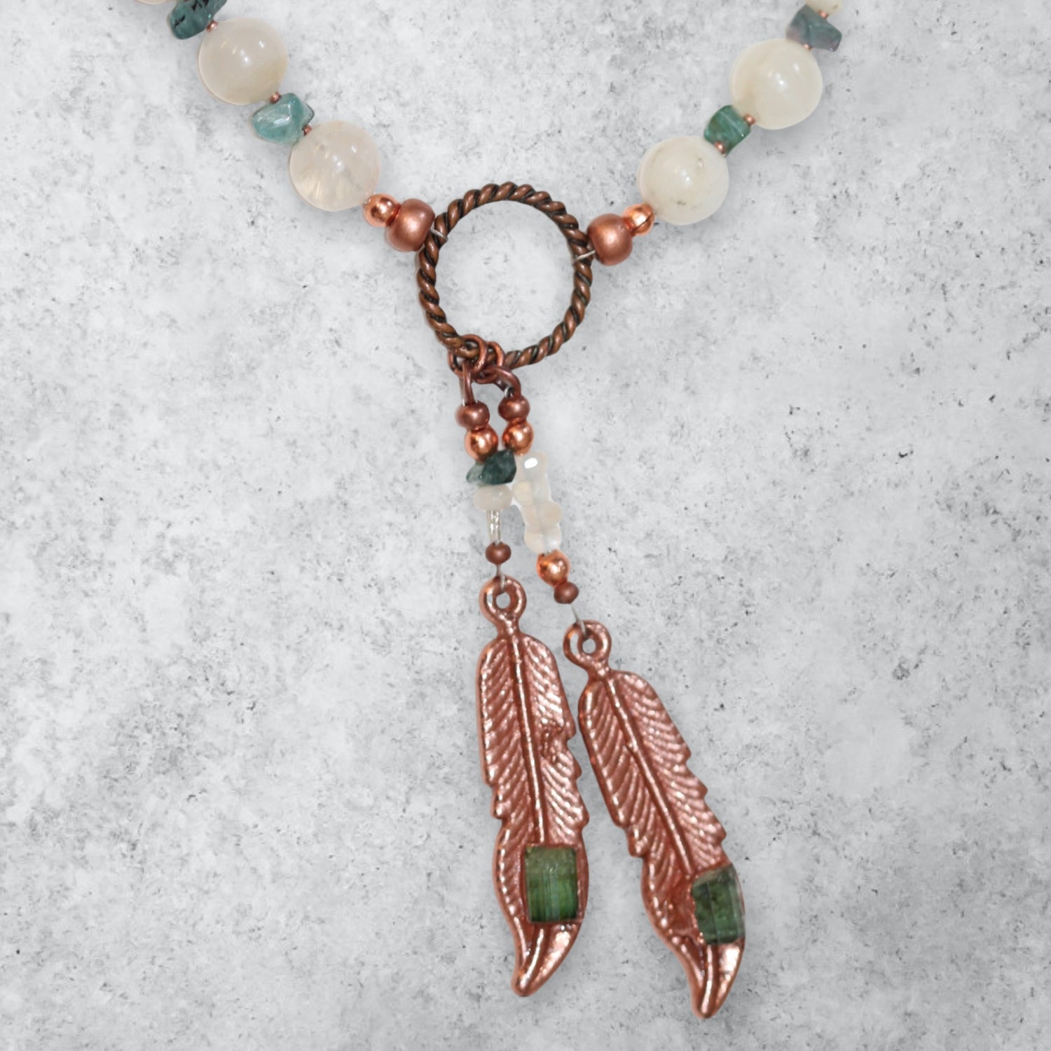 Round moonstone beaded necklace with Electroformed feathers and green tourmaline 