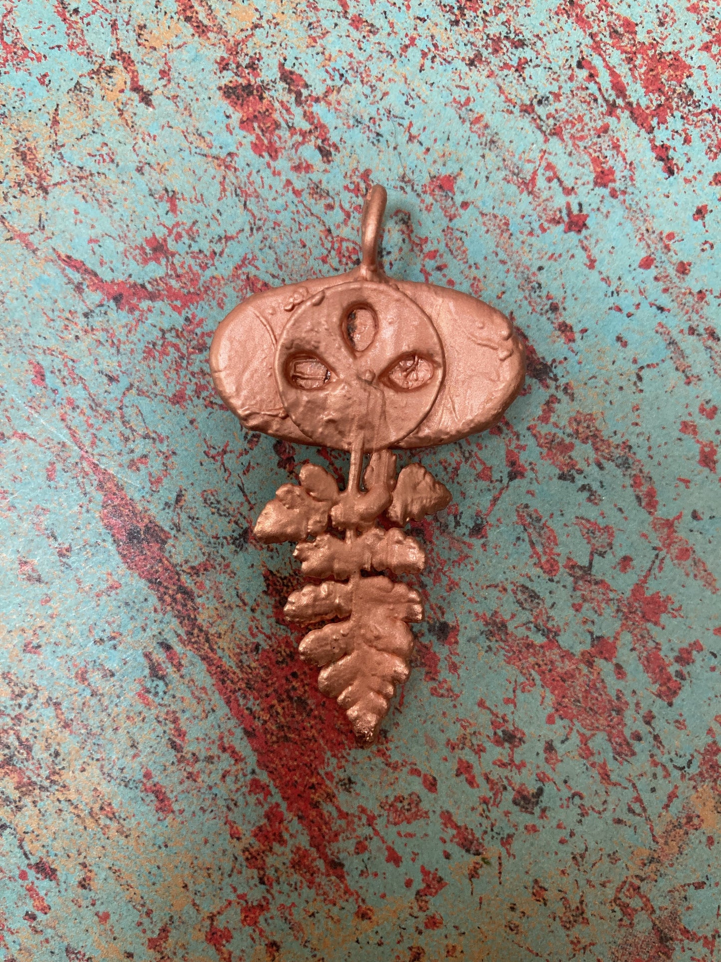 back of handmade copper pendant